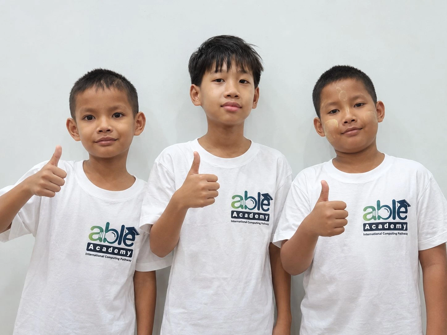 Able Academy students celebrating their learning progress